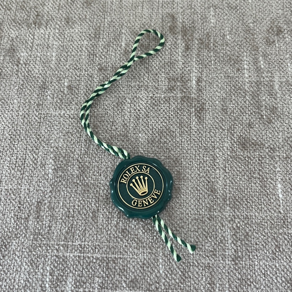Rolex hologram green hang tag